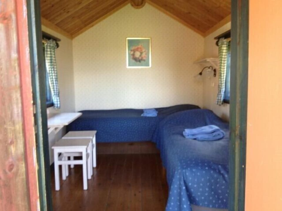Cabin, 2 Twin Beds, Shared Bathroom, Lake View | Blackout drapes, iron/ironing board (on request), cribs (free)