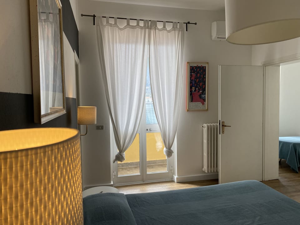 Deluxe Triple Room, 2 Bedrooms, Sea View | Minibar, in-room safe, free WiFi, bed sheets