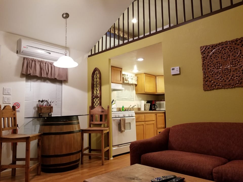 Peach Cabin, 1 Bedroom | Living area | Flat-screen TV