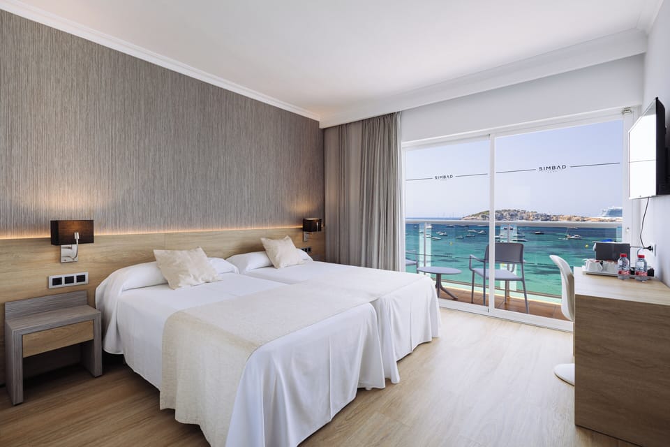 Twin Room, Terrace, Sea View | Minibar, in-room safe, desk, blackout drapes