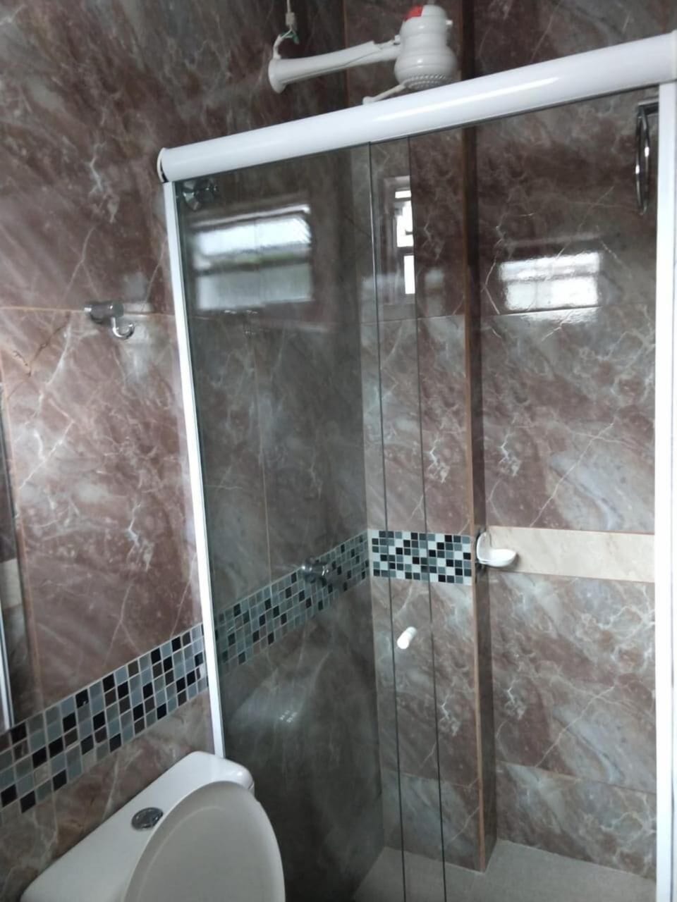 Shower, hair dryer, slippers, towels