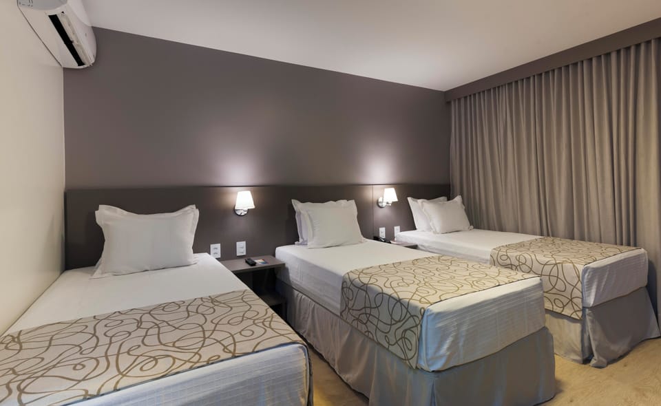 Deluxe Triple Room | 1 bedroom, premium bedding, minibar, in-room safe