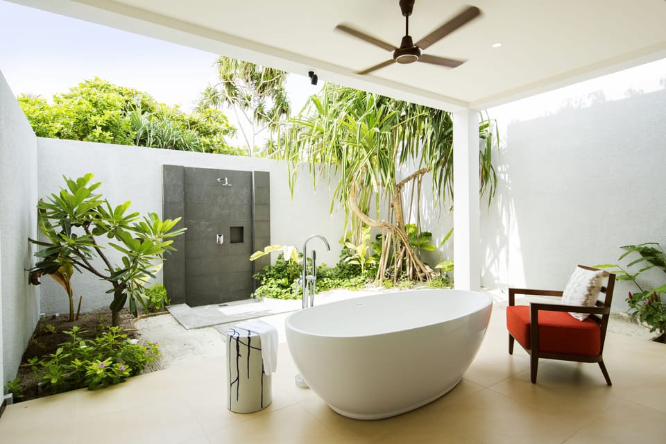 Separate tub and shower, designer toiletries, hair dryer, bathrobes