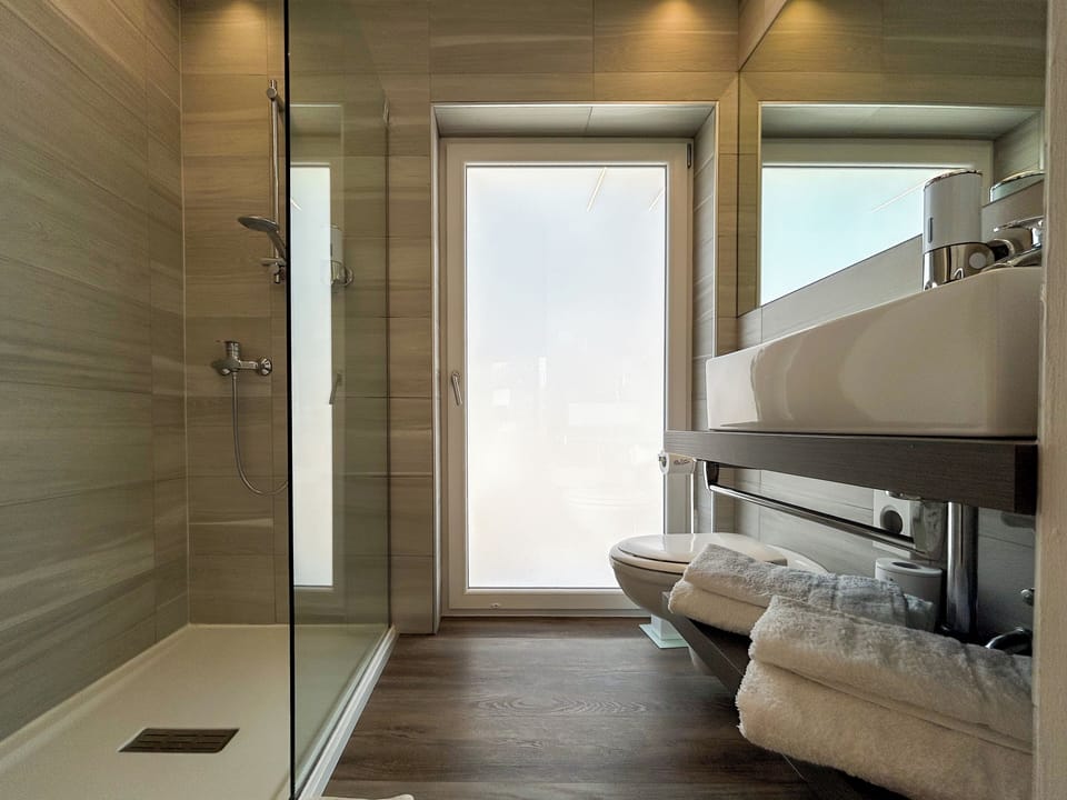 Shower, rainfall showerhead, designer toiletries, hair dryer