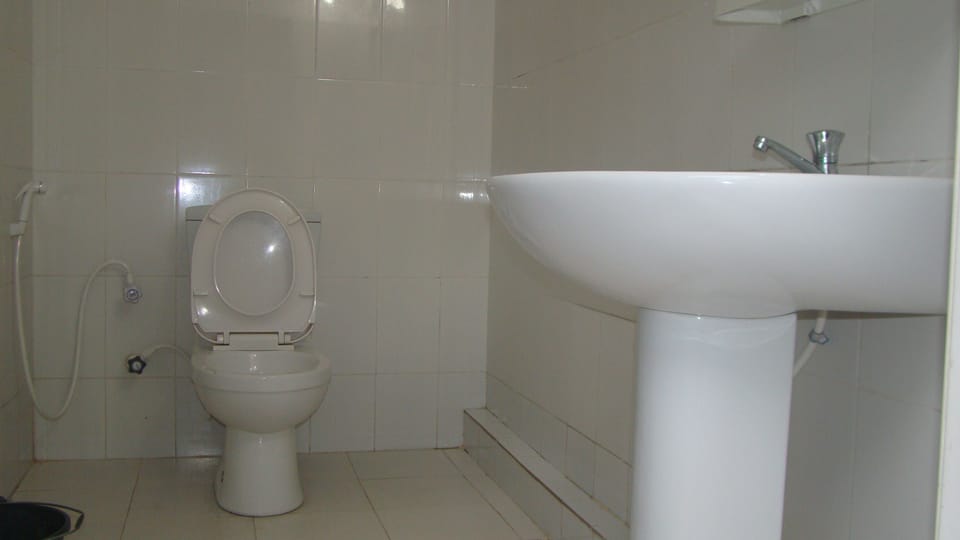 Shower, slippers, bidet, towels