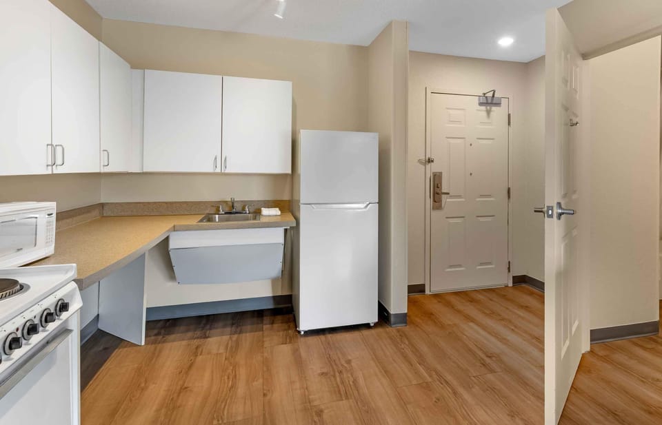 Deluxe Studio, 1 Queen Bed with Sofa bed, Accessible, Non Smoking | Private kitchen | Full-size fridge, microwave, stovetop, coffee/tea maker