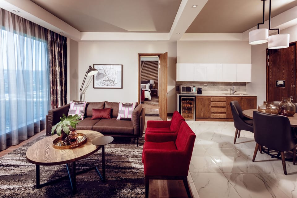 Executive Suite, 1 King Bed | Living room | TV