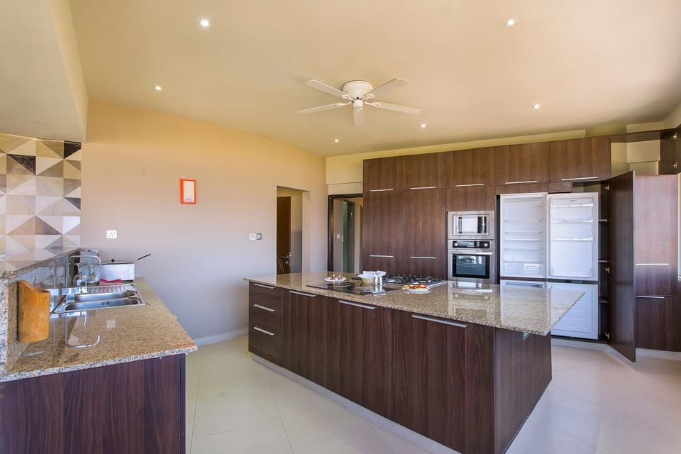 Fridge, electric kettle, dining tables