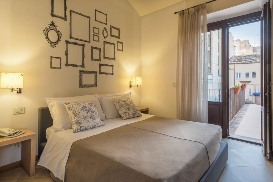 Superior Triple Room | Minibar, in-room safe, individually decorated, individually furnished