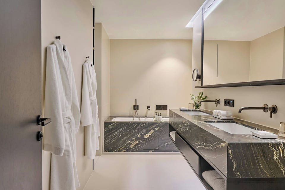 Designer toiletries, hair dryer, bathrobes, slippers