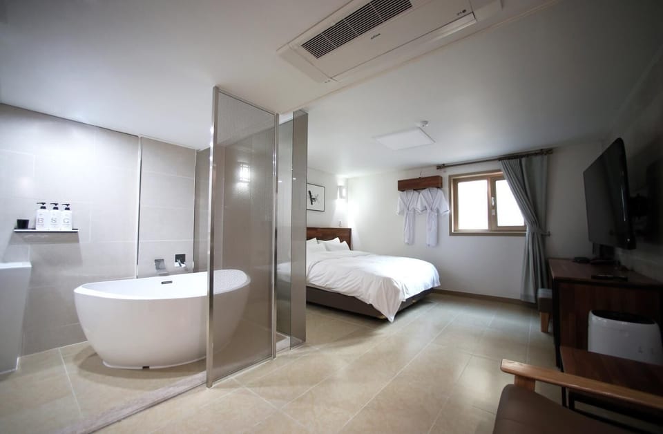 Premium bedding, down comforters, desk, laptop workspace