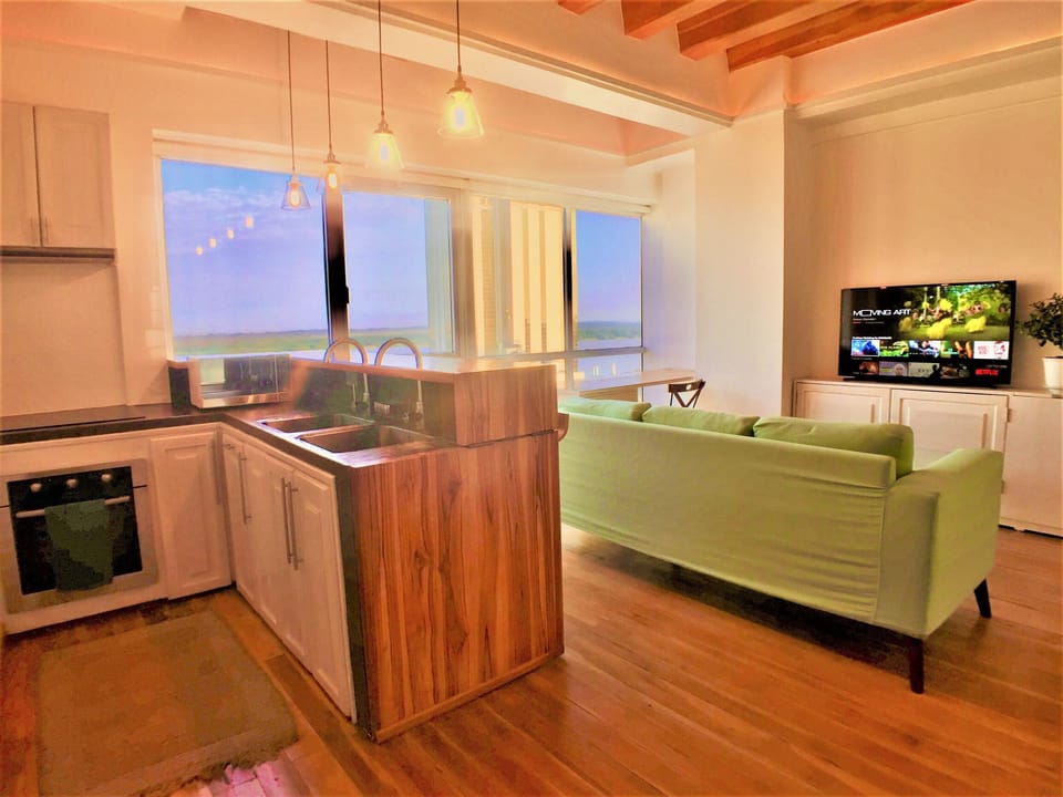 Luxury Apartment, 1 Bedroom, River View | Private kitchen | Coffee/tea maker, full-size fridge, microwave, oven