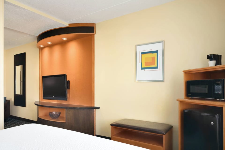 Desk, laptop workspace, blackout drapes, iron/ironing board