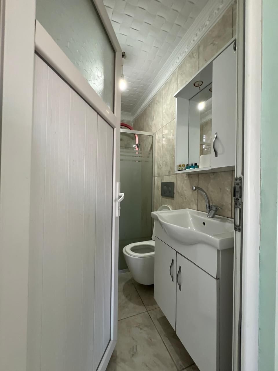 Shower, free toiletries, hair dryer, slippers