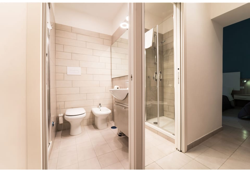 Grand Double Room, Courtyard View | Bathroom | Shower, free toiletries, hair dryer, slippers