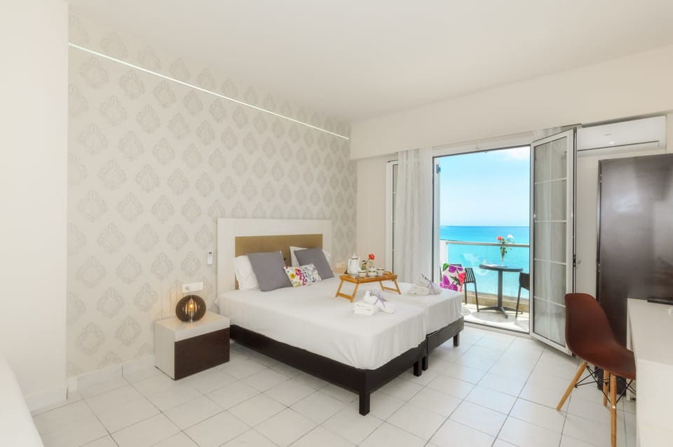 Triple Room, Balcony | In-room safe, iron/ironing board, free WiFi, bed sheets