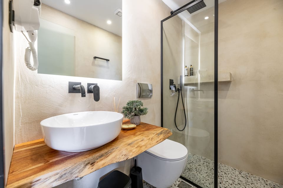 Triple Room, Patio | Bathroom | Shower, free toiletries, hair dryer, towels