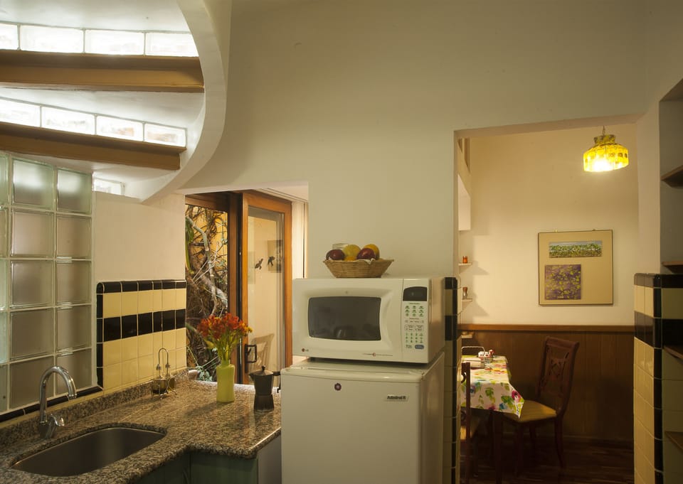 Premium Suite, 1 King Bed | Private kitchenette | Microwave, coffee/tea maker, electric kettle