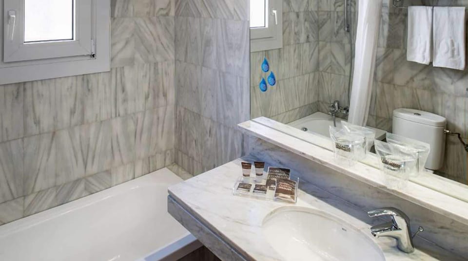 Eco-friendly toiletries, hair dryer, towels