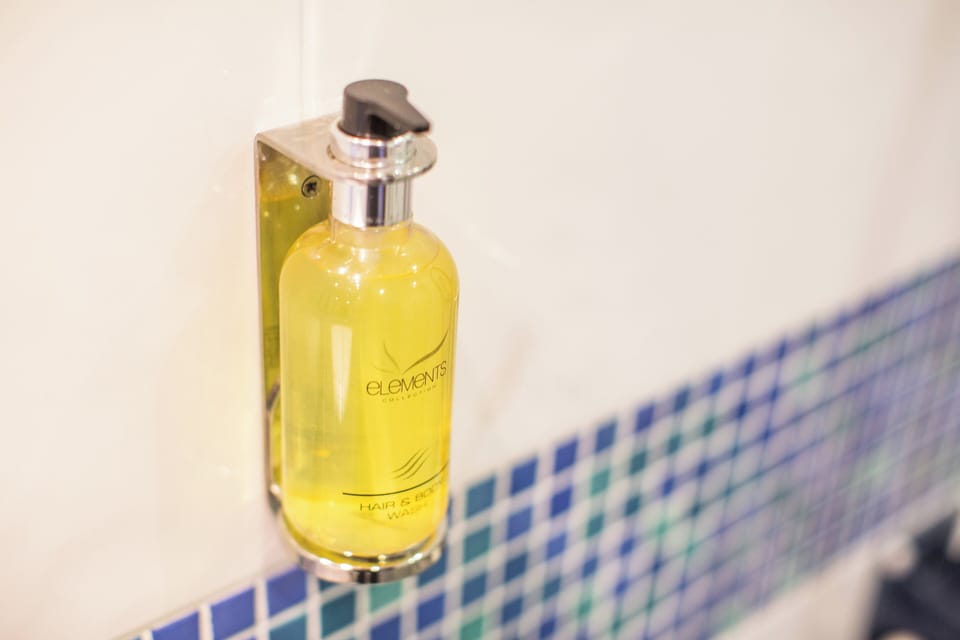 Shower, eco-friendly toiletries, hair dryer, towels