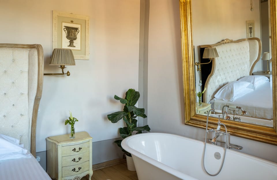 Deluxe Room, 1 Bedroom, Garden View | Minibar, in-room safe, desk, iron/ironing board