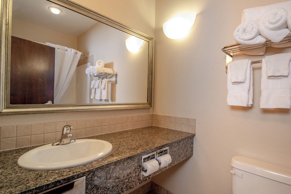 Combined shower/tub, hair dryer, towels, soap