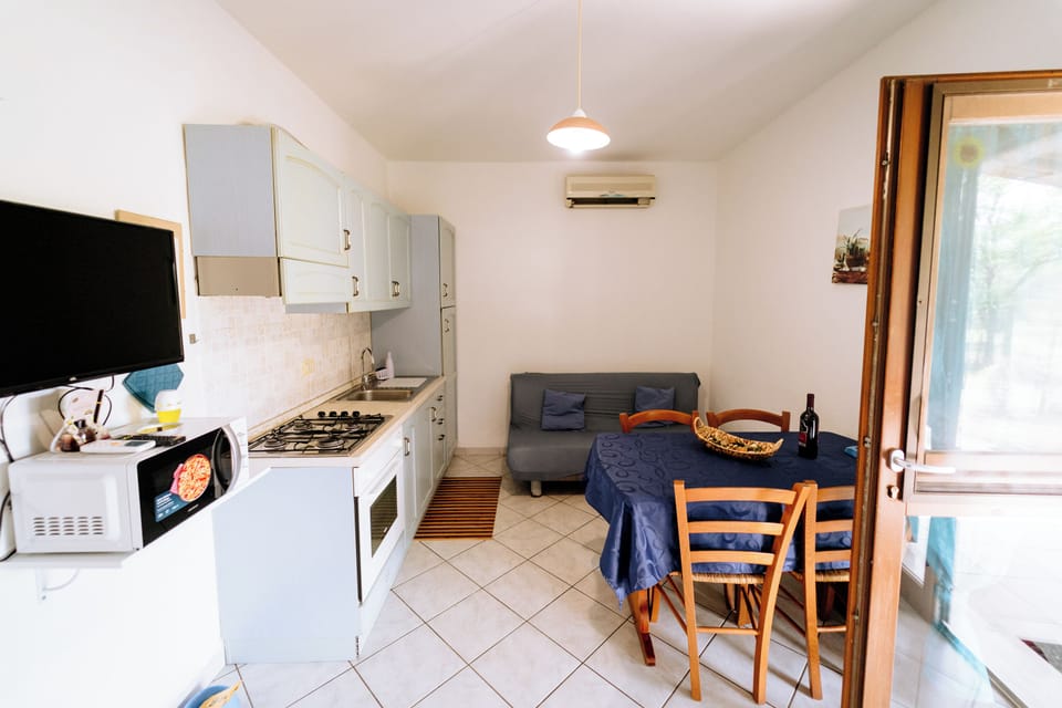 Comfort Apartment, 1 Bedroom, Private Bathroom, Ground Floor | Living area | 32-inch flat-screen TV with digital channels, TV