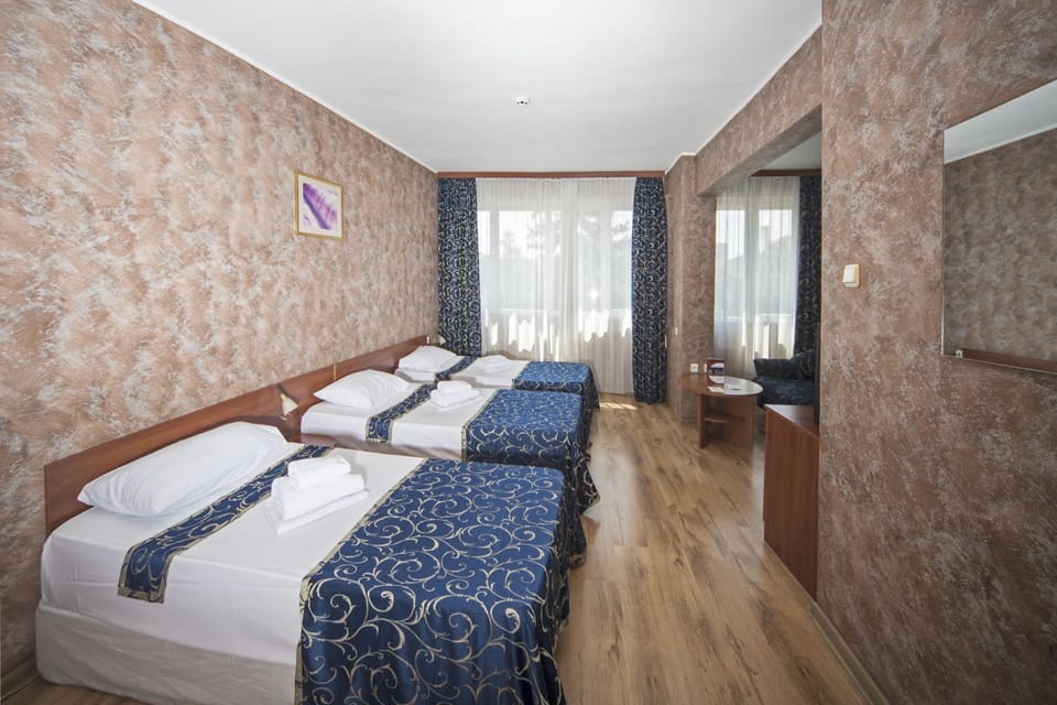 Triple Room | Minibar, desk, iron/ironing board, free cribs/infant beds