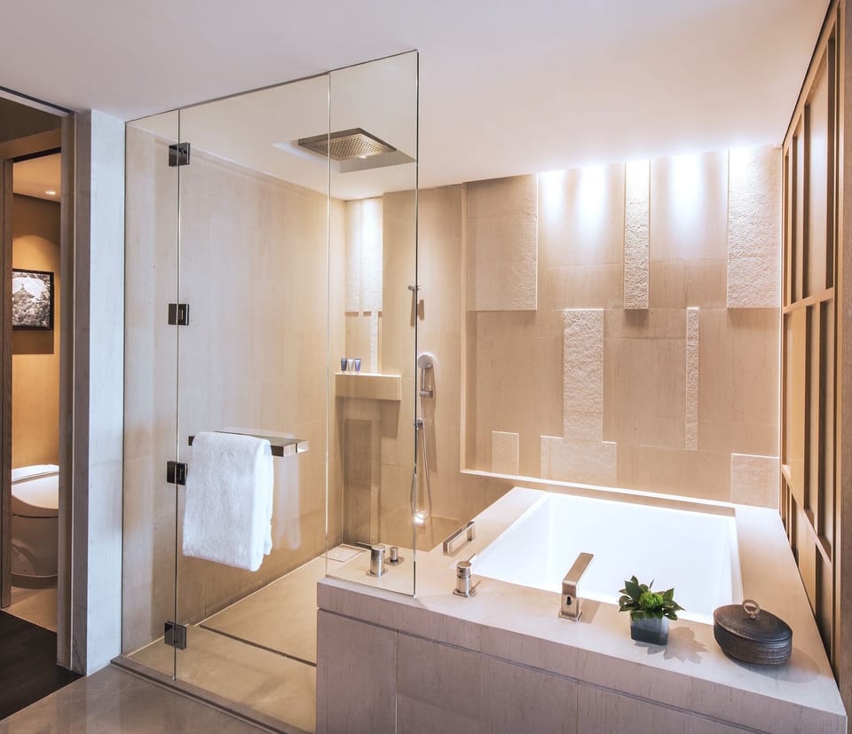 Separate tub and shower, deep soaking tub, designer toiletries