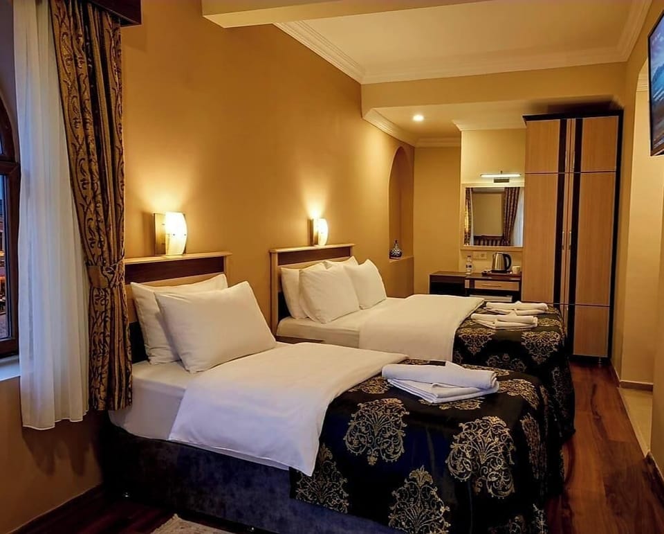 Family Twin Room, Pool View | Minibar, desk, laptop workspace, soundproofing