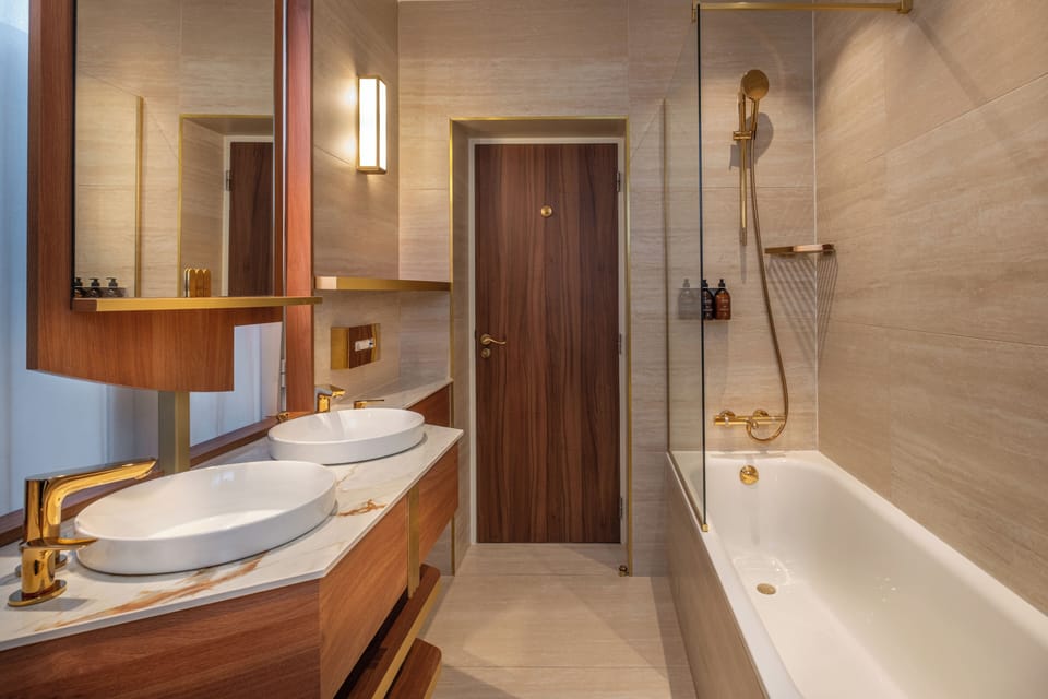 Junior Suite | Bathroom | Rainfall showerhead, designer toiletries, hair dryer, slippers