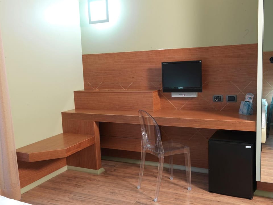Down comforters, memory foam beds, in-room safe, desk