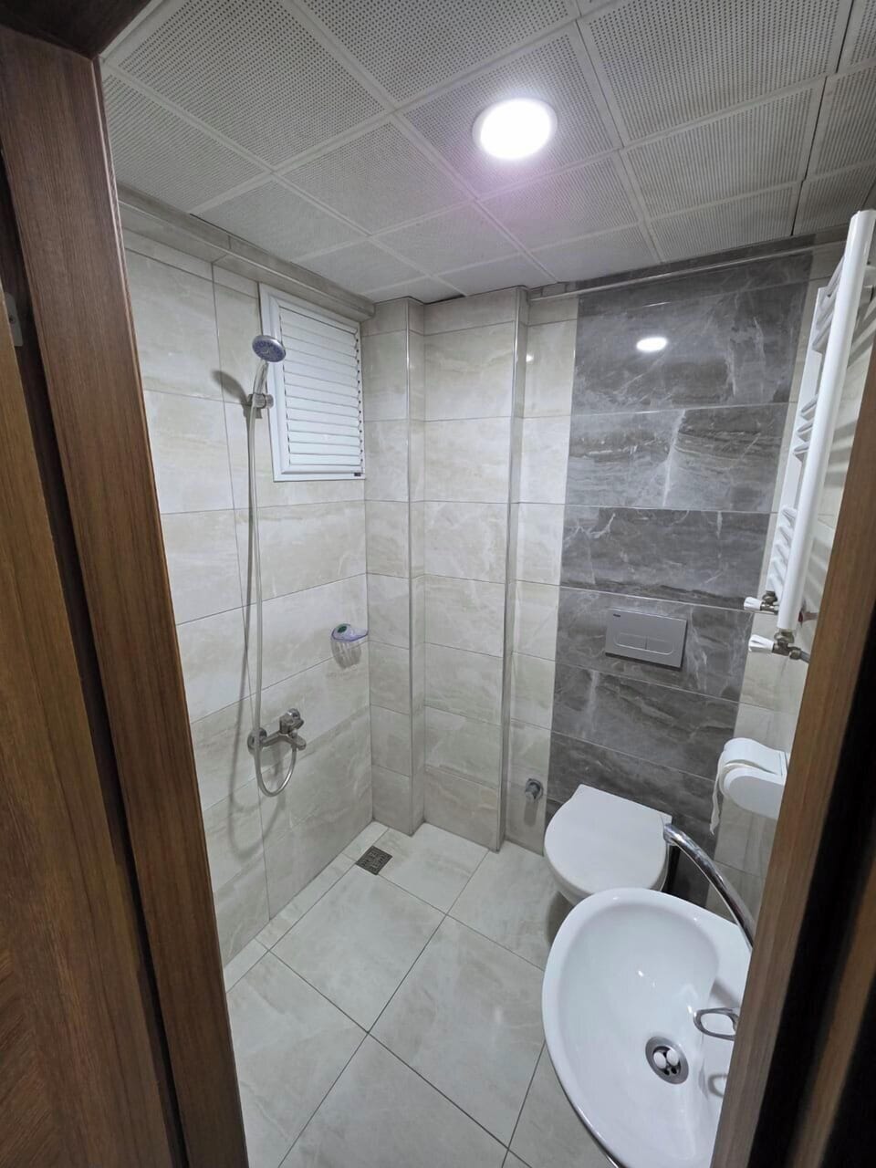 Shower, free toiletries, hair dryer, slippers