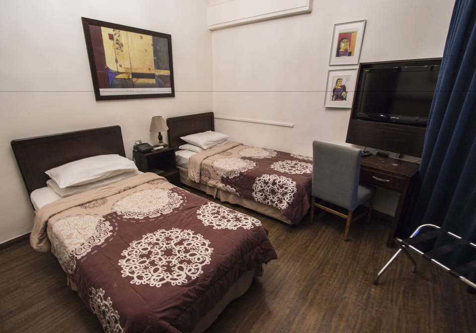 Double or Twin Room | Minibar, desk, WiFi (free), bed sheets