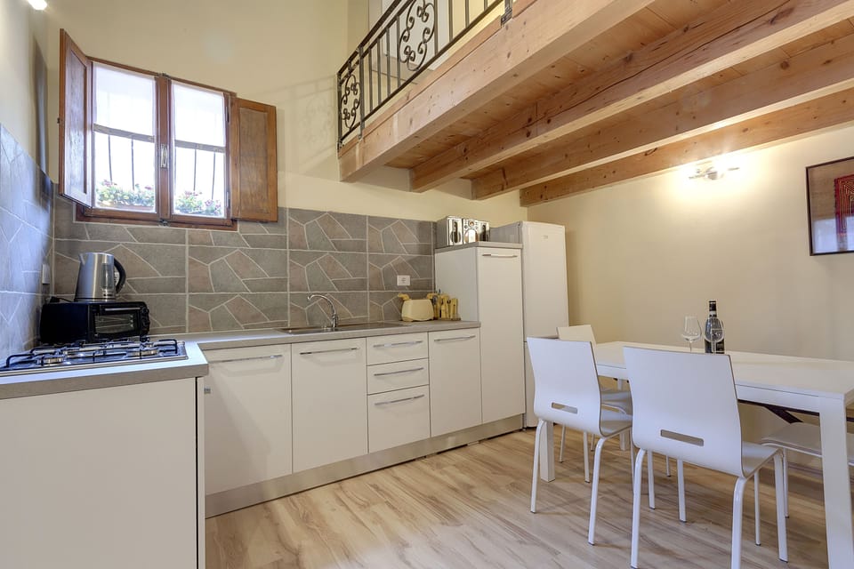 Apartment, 1 Bedroom | Private kitchenette | Full-size fridge, stovetop, coffee/tea maker, electric kettle