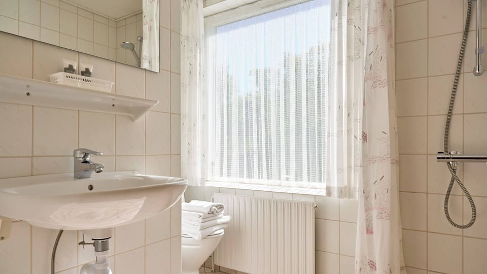 Double room facing land | Bathroom | Shower, hair dryer, towels, soap
