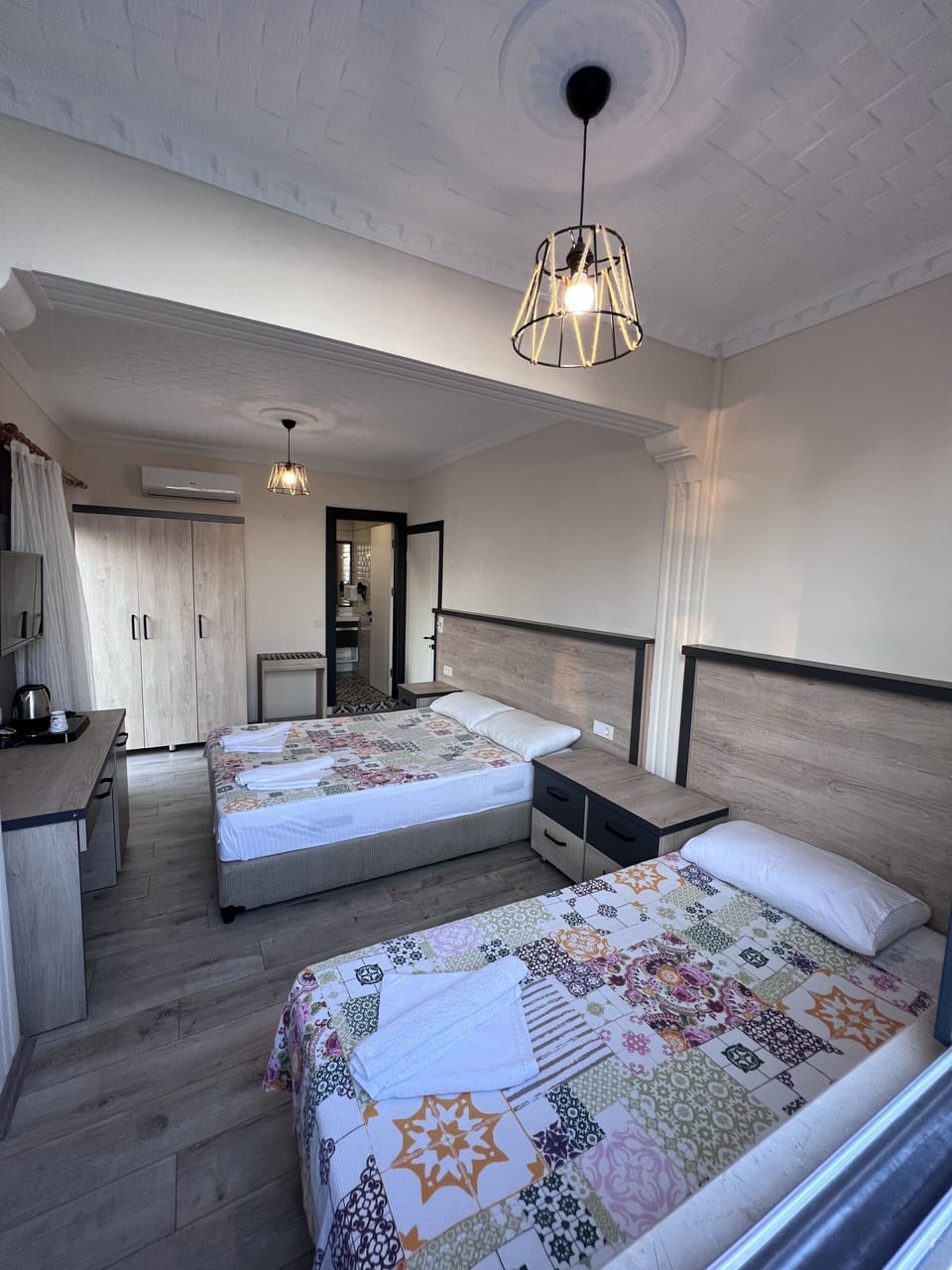 Standard Triple Room | Minibar, in-room safe, desk, soundproofing