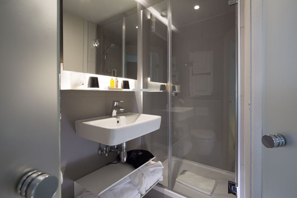 Designer toiletries, hair dryer, bathrobes, slippers