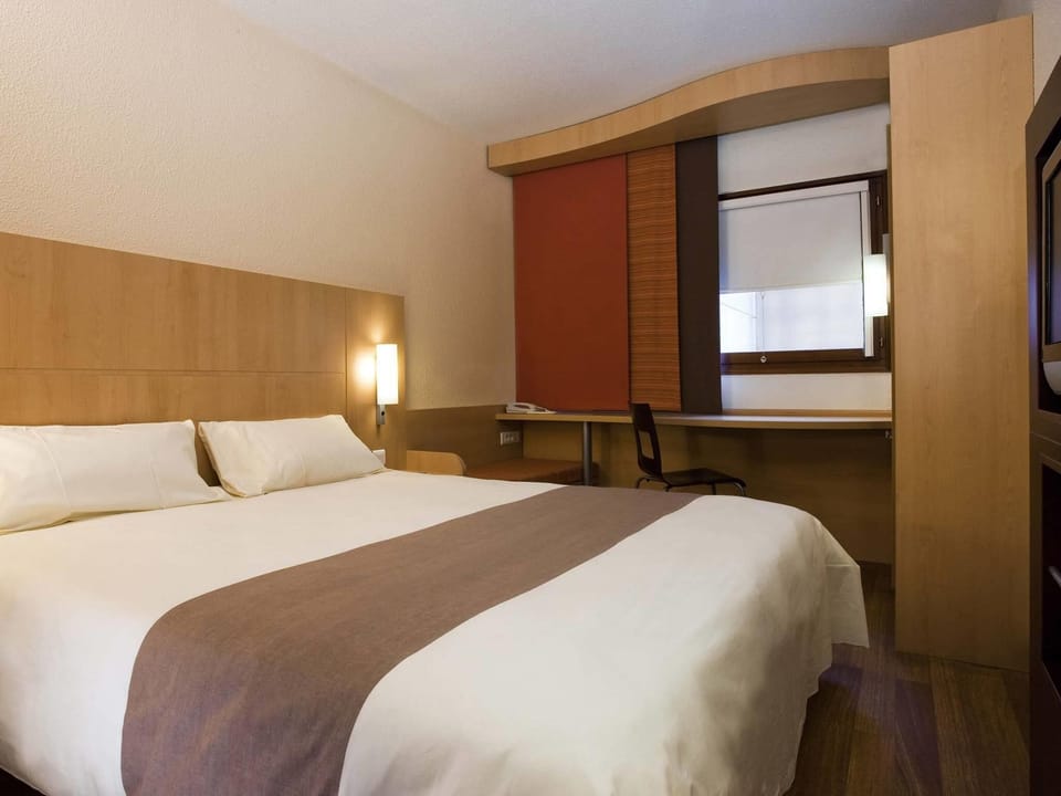 Hypo-allergenic bedding, desk, blackout drapes, soundproofing