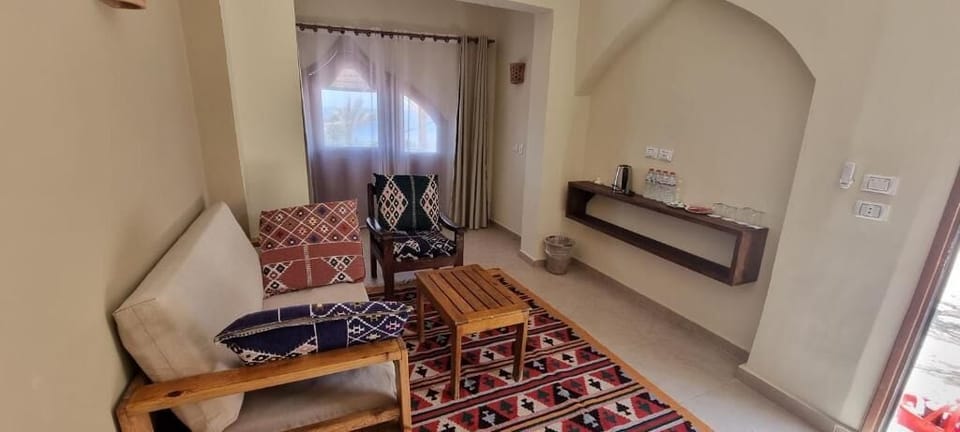 Family Apartment | Living area | 32-inch LED TV with cable channels, TV, streaming services