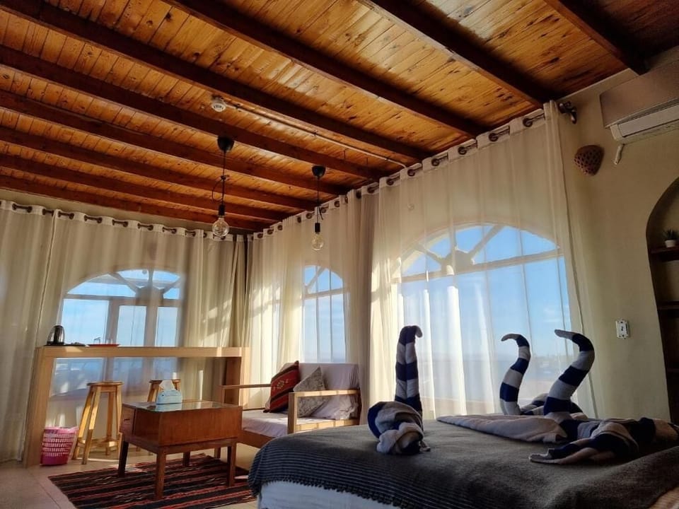 Panoramic Room | Minibar, in-room safe, desk, blackout drapes