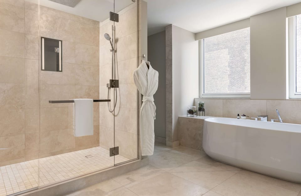 Designer toiletries, hair dryer, bathrobes, slippers