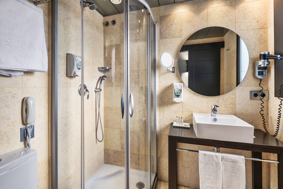 Shower, free toiletries, hair dryer, towels