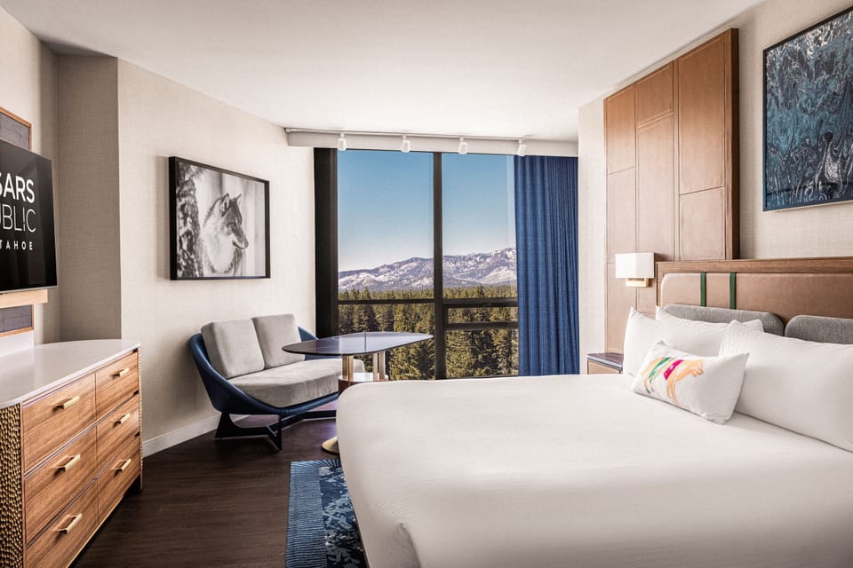 Premium bedding, desk, laptop workspace, blackout drapes