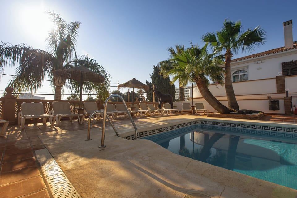 Outdoor pool, pool umbrellas, sun loungers