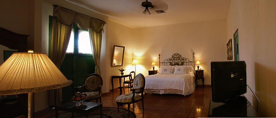 Superior Suite, 1 King Bed, Smoking | Premium bedding, in-room safe, desk, iron/ironing board
