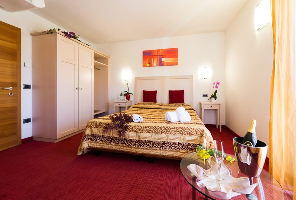 Deluxe Room, Multiple Beds | In-room safe, desk, soundproofing, travel crib