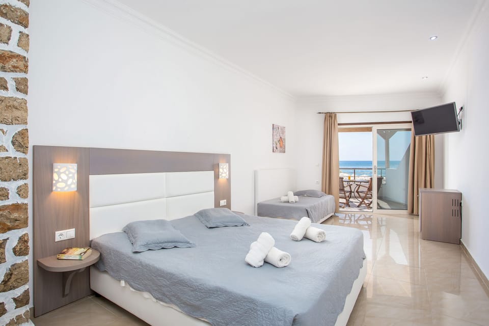 Room, Beachfront | In-room safe, soundproofing, iron/ironing board, free WiFi