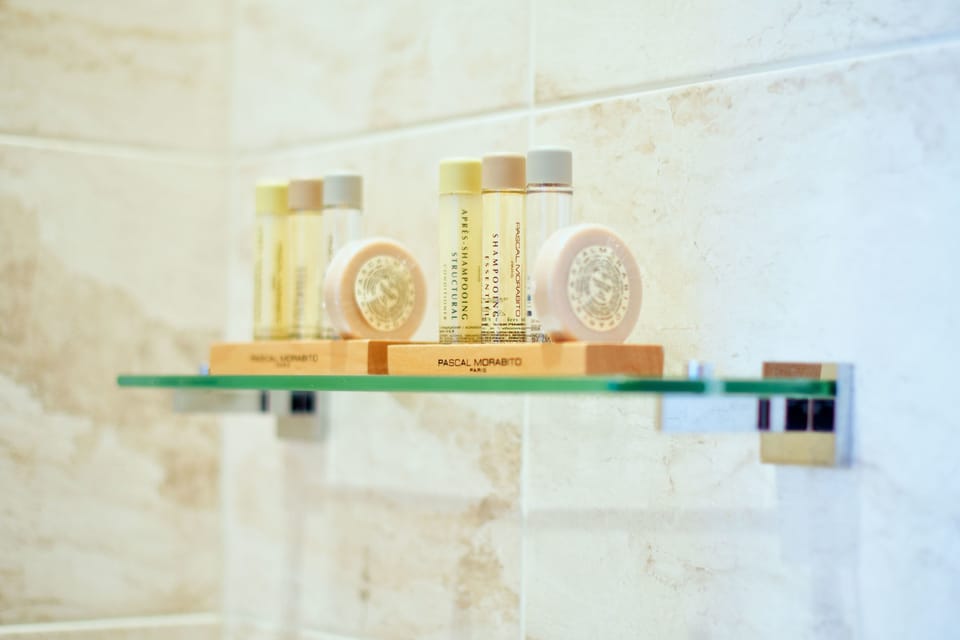 Premium bedding, desk, laptop workspace, iron/ironing board