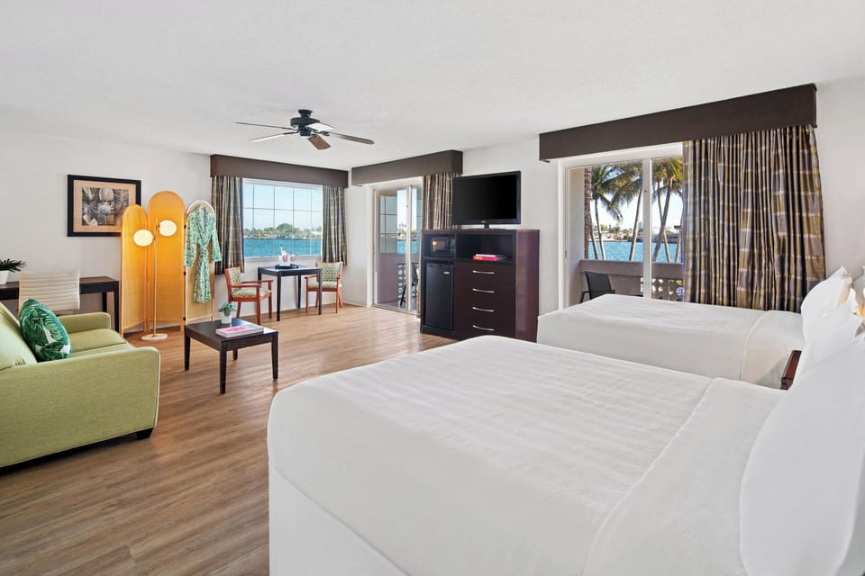 Junior Suite, Multiple Beds, Balcony, Bay View | In-room safe, desk, blackout drapes, iron/ironing board